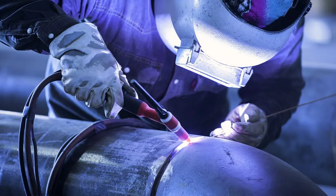 Man weld a pipe with TIG welding process.